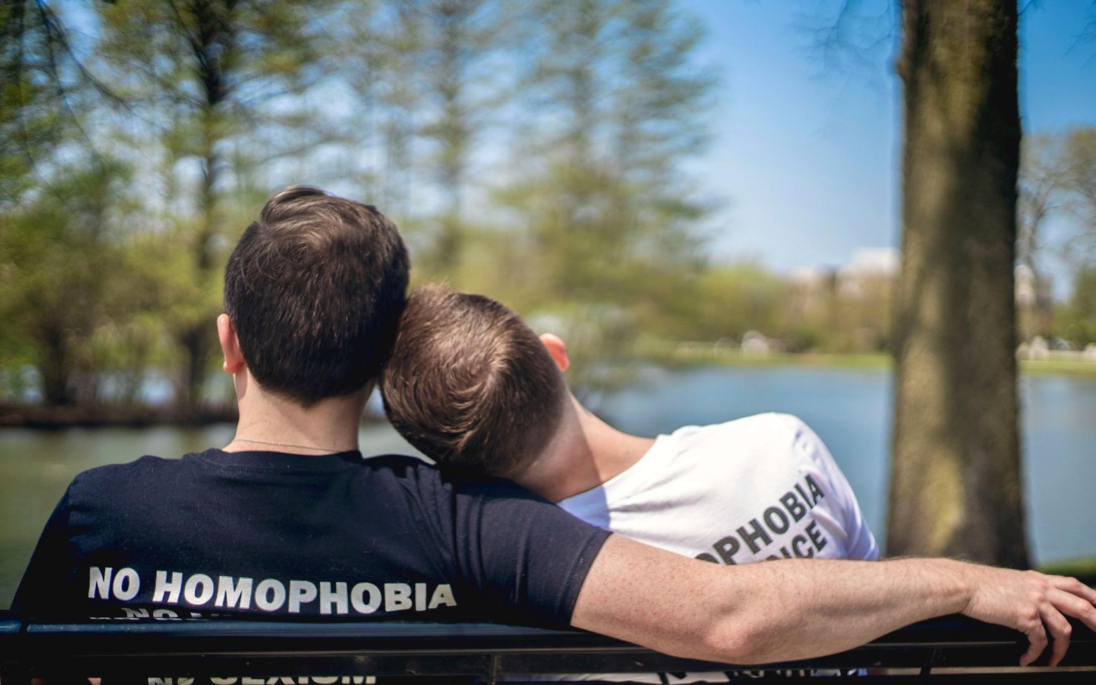 The printed cover of ILGA World's State-Sponsored Homophobia annual report, edition year visible, held open on a desk