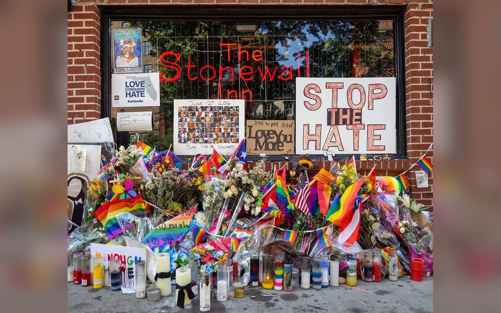 The exterior of the Stonewall Inn on Christopher Street, New York, with the National Monument designation plaque visible on the facade